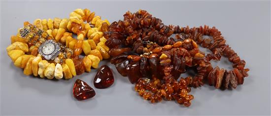 A small group of assorted amber necklaces, pebbles etc.